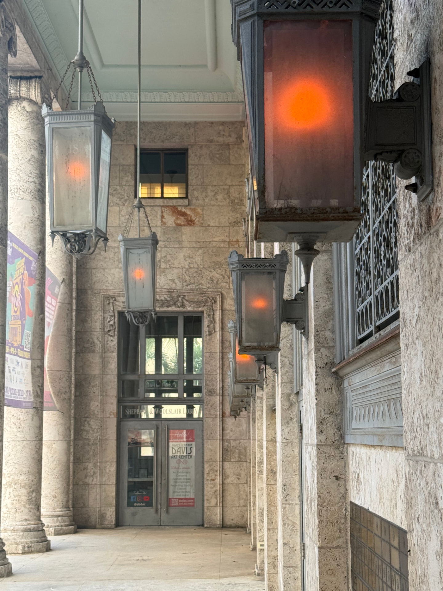 Main entrance hallway of the Sidney & Berne Davis Art Center, with hanging lanterns